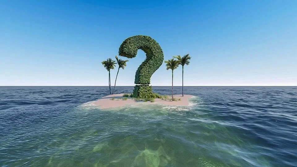 Question mark on solid land in the middle of the open sea