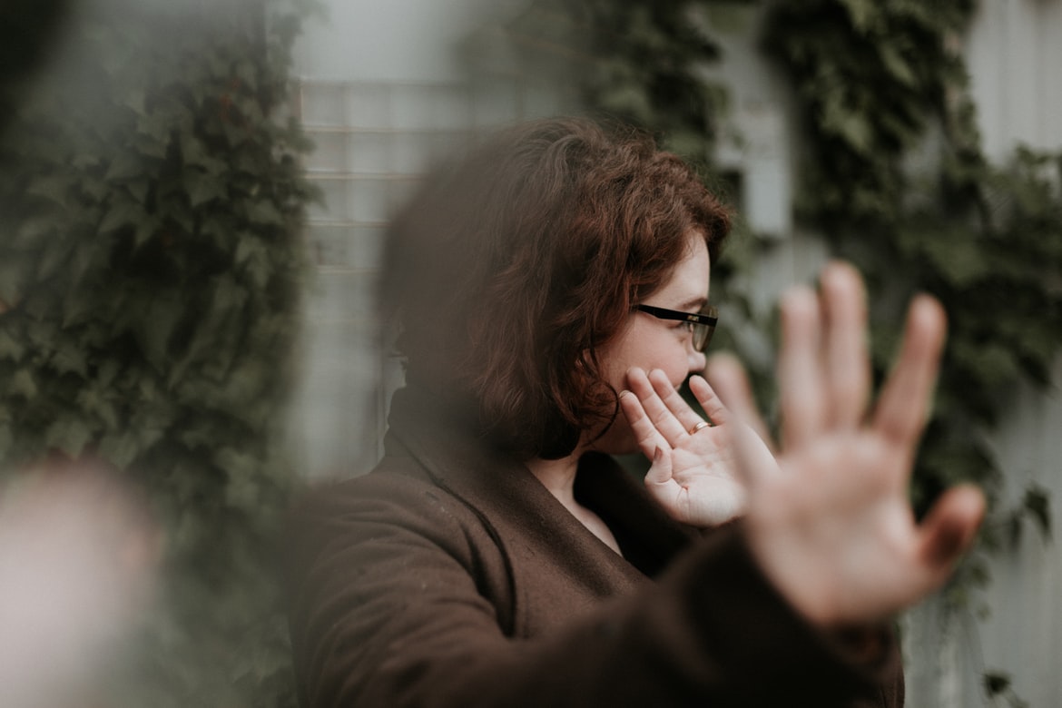 A woman holding her hands out in front of her